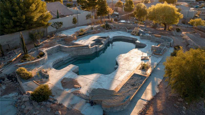 Freshly built and filled swimming pool during the plaster curing window